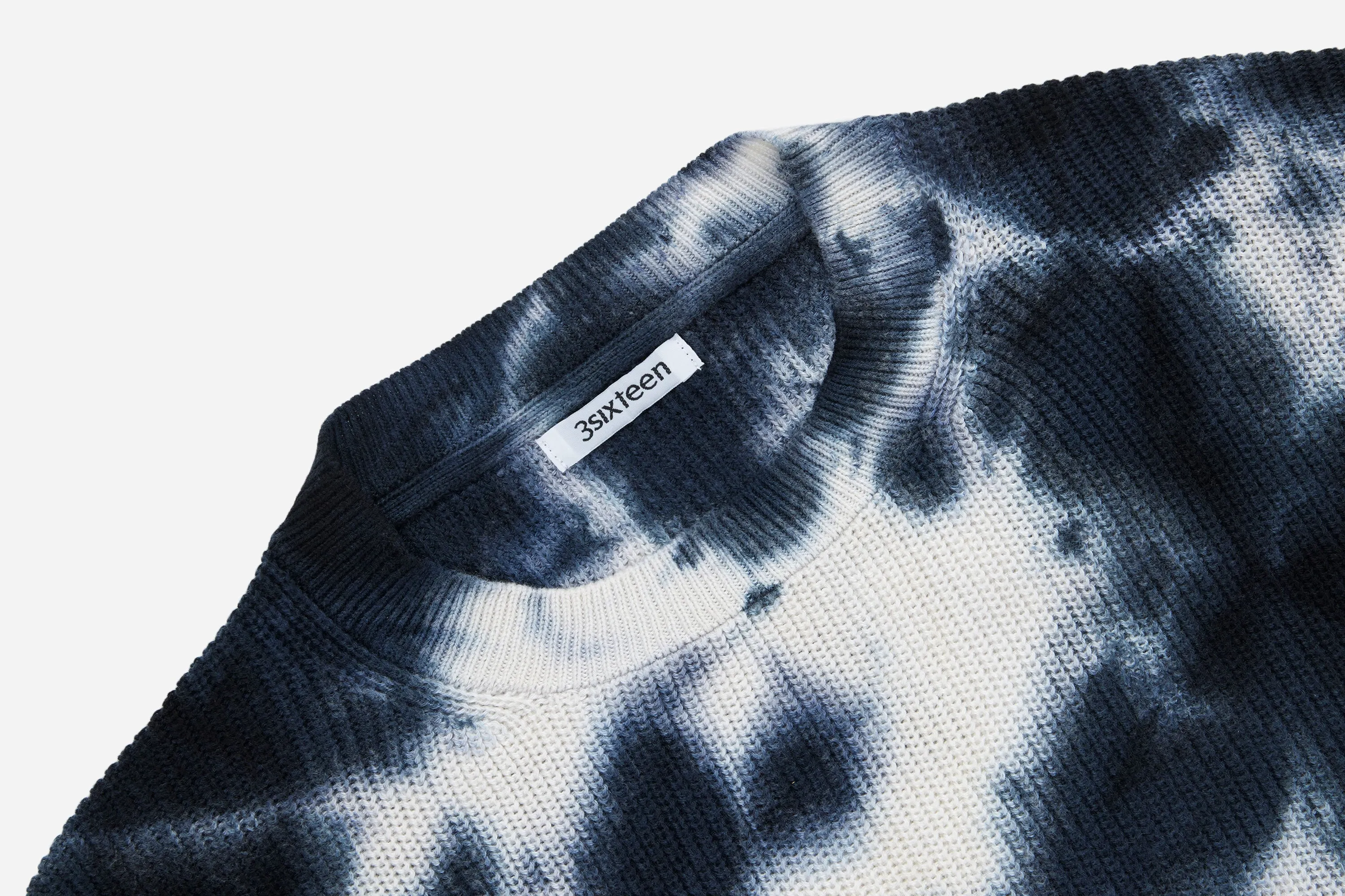 Sure! Here is an optimized title for the e-commerce product:

Stylish Ink Blot Garment-Dyed Knit Long Sleeve Sweater for Ultimate Comfort