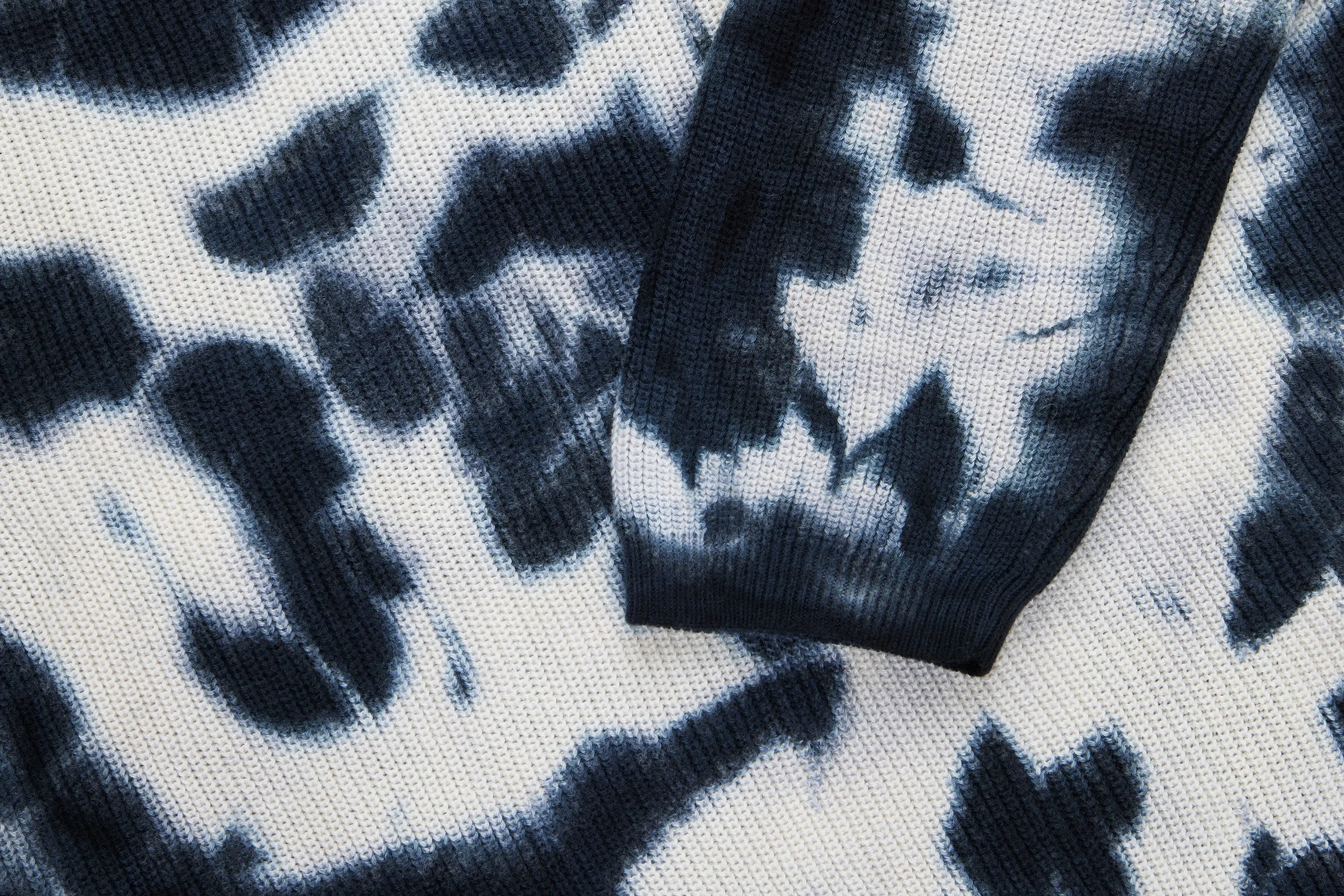 Sure! Here is an optimized title for the e-commerce product:

Stylish Ink Blot Garment-Dyed Knit Long Sleeve Sweater for Ultimate Comfort